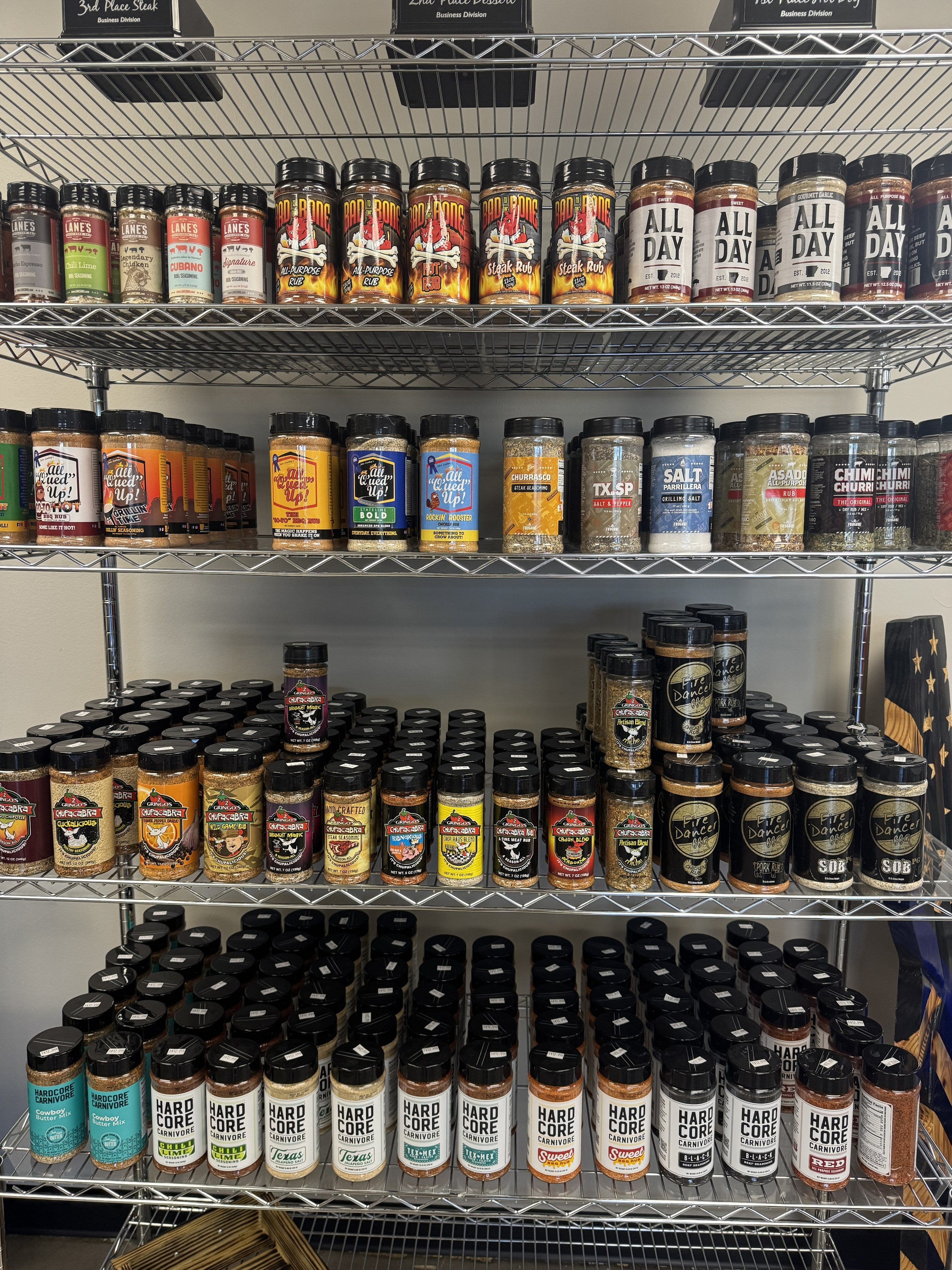 Rubs and seasonings on display at Conway BBQ Supply