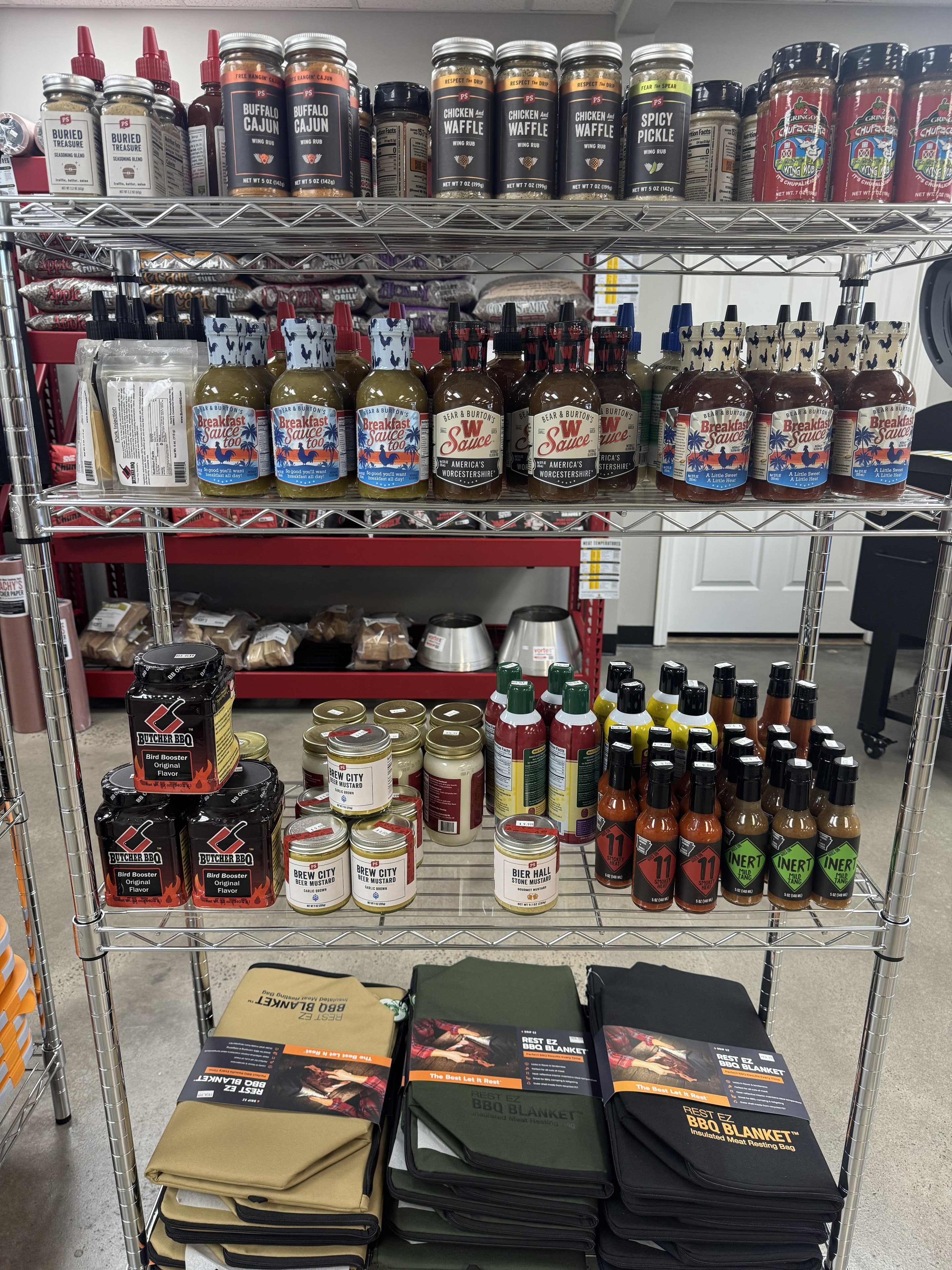 Sauces, glazes and marinades shelf at Conway BBQ Supply