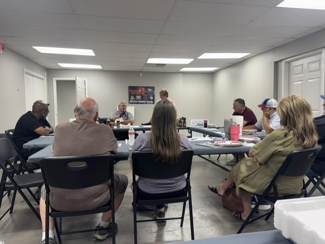 Students gathered at a Conway BBQ Supply cooking class